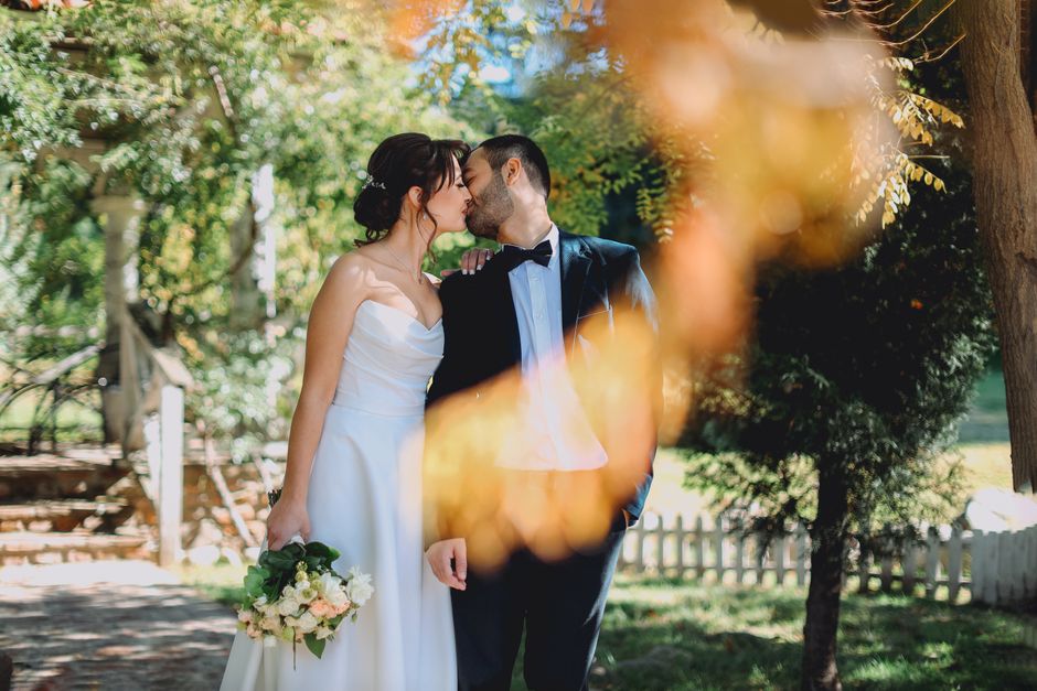 Newlywed couple in a sunlit garden